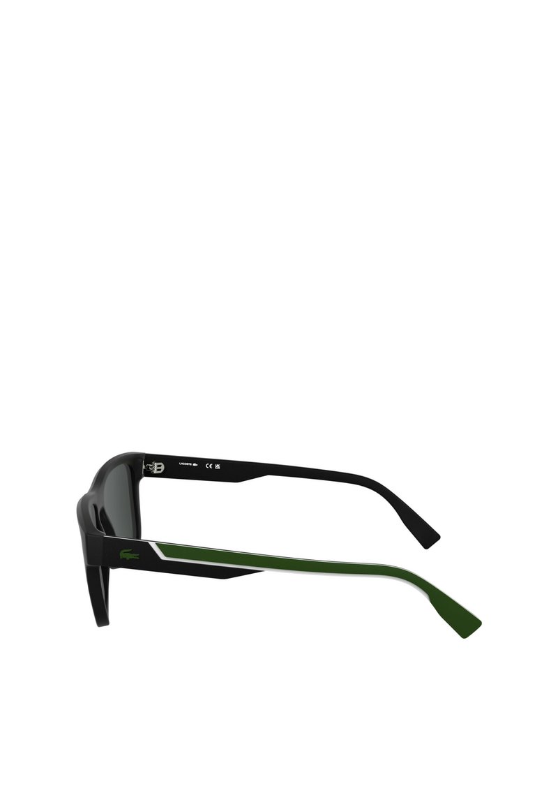 Black sunglasses with green accents, rectangular lenses, and thick frames. Features a logo on the side and a textured finish on the temples.