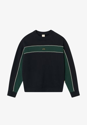 Tumesinine dressipluus rohelise horisontaalse triibuga, valge ääre ja soonikkoes käiste ning kraega; esiküljel on kuldne logo, mis on keskendatud rinnaof.