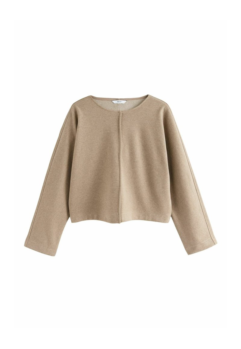 Beige cropped sweater made of soft fabric, features a round neckline, long sleeves, and a center seam detailing on the front.