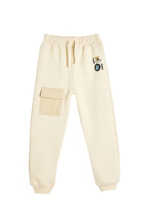 Pantalones deportivos color crema con cinturilla elástica, cordón, bolsillo lateral y diseños gráficos divertidos en la parte frontal. Material suave.