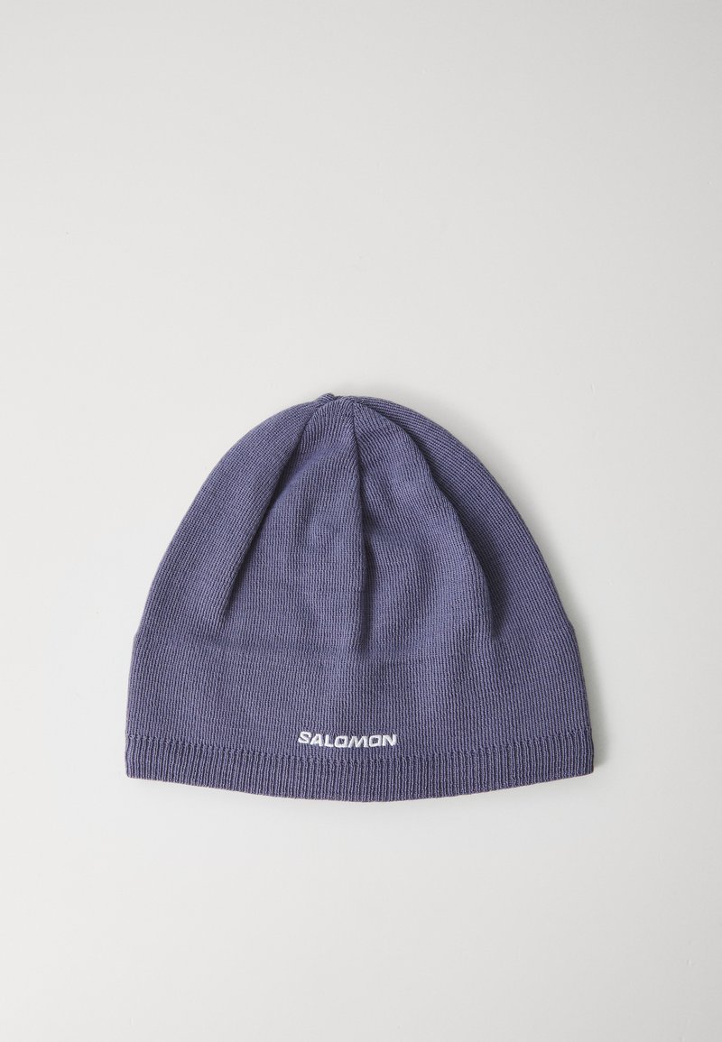Gorro de malha roxo com o logótipo branco "Salomon" bordado na parte da frente, colocado plano sobre um fundo branco liso.