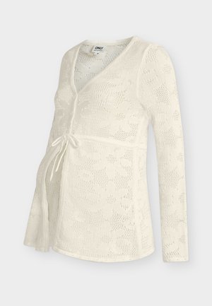 Valge pika varrukaga rasedusteemaline kardigan lillelise pitsimustriga, V-kaelusega ja ees nööriga talje detailiga.