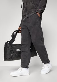 Champion ICONS CUFF PANTS - Tréningruha alsók - black