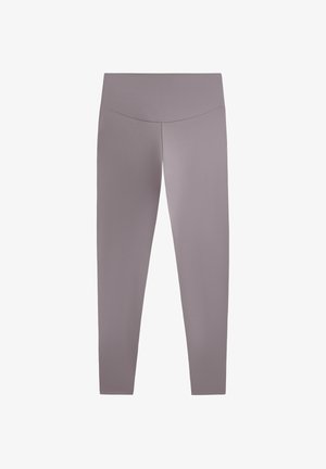 Leggings dalam warna mauve terang, terbuat dari kain yang halus dan dapat meregang. Dilengkapi dengan pinggang tinggi dan siluet yang pas. Tidak ada pola atau aksen yang terlihat.