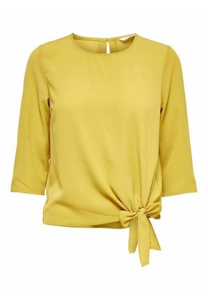 Żółta bluzka z rękawem do połowy przedramienia, okrągłym dekoltem i wiązaniem na supeł po bokach w talii.