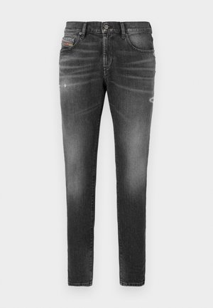 Grå denimjeans med slim fit, med lette slitte detaljer, distressed detaljer og tradisjonell knappeåpning.