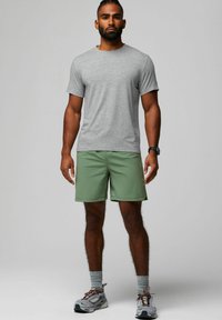 Gray short-sleeve t-shirt, green shorts, gray socks, and gray athletic shoes. Minimalist design with a relaxed fit.