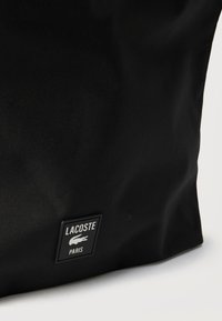 Lacoste SHOULDER BAG UNISEX - Shoppingveske - noir