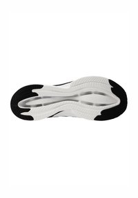 Semelle de chaussure de sport en noir et blanc avec un motif de grip texturé, une forme incurvée et un design de semelle distinct pour une traction améliorée.