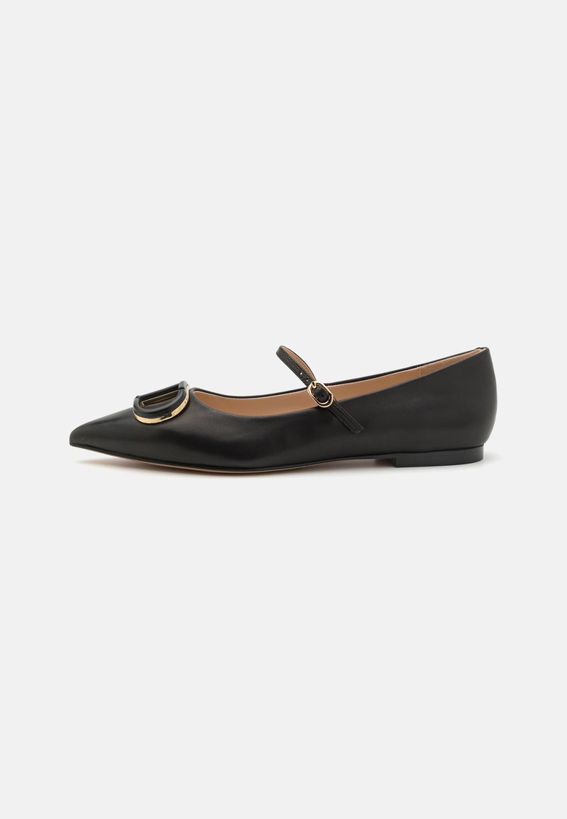 Black leather ballet flats with a pointed toe, featuring a gold buckle accent and a thin ankle strap. Flat sole with minimal texture.