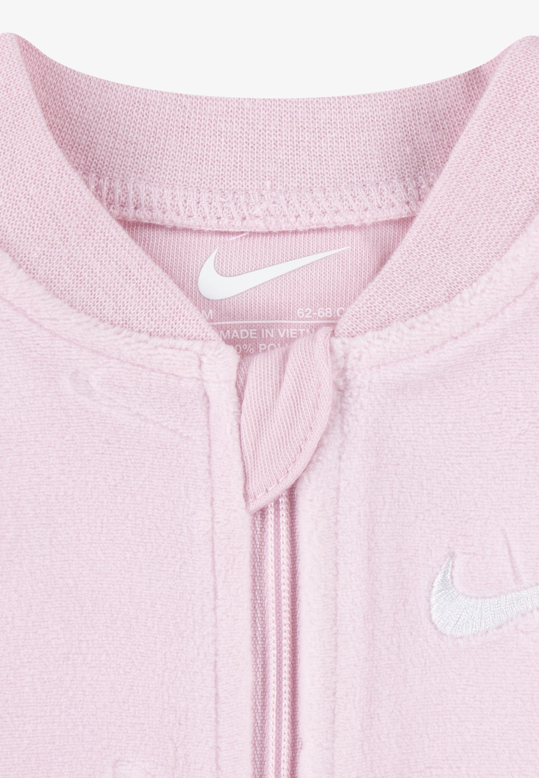 pink and white nike jogging suit