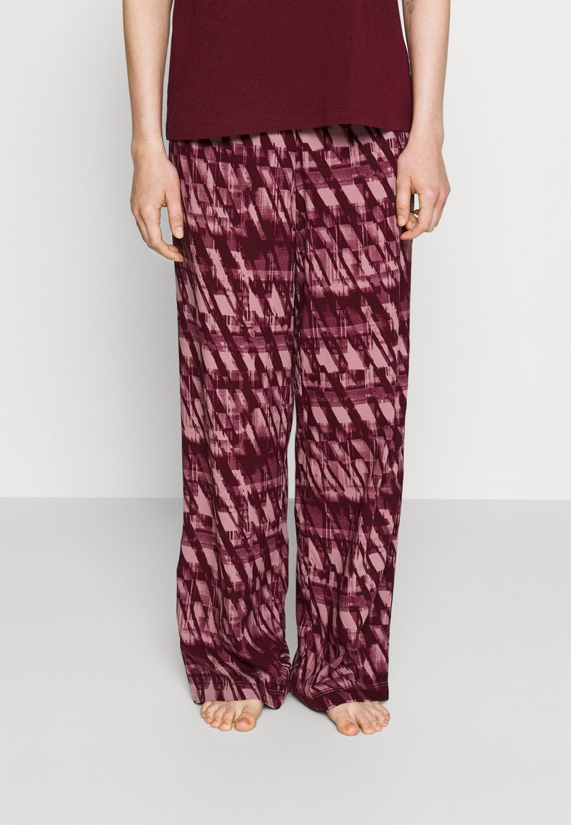Bordeaux gekleurde broek met een geometrisch patroon, gemaakt van lichte stof. Losse pasvorm met een wijde pijpendesign en een elastische tailleband.