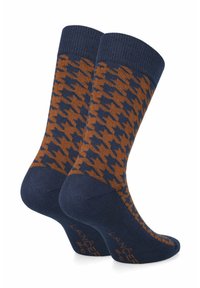 Granatowe skarpetki w pomarańczowy wzór w jodełkę. Posiadają ściągacz oraz wzmocnioną piętę. Miękka tekstura, idealna do użytku casualowego lub formalnego.