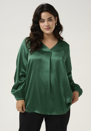 Green satin blouse with a V-neck, pleated front, and long, gathered sleeves. Smooth texture with a relaxed fit and side slits.
