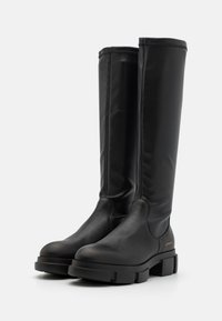Knee-high black boots made of smooth leather, featuring a sturdy block heel, rounded toe, and seamless design with subtle stitching details.