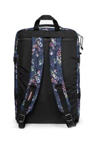 Black backpack featuring floral-patterned straps and panel. Material is durable fabric; includes adjustable straps and a top carry handle.