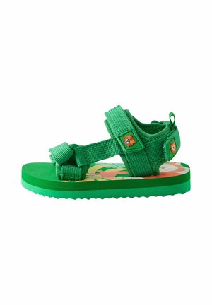 Grüne Kindersandale mit verstellbaren Riemen, Tiger-Gesicht-Applikationen und buntem floralem Innensohlen-Design.