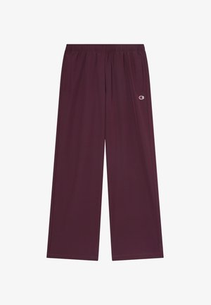 Dunkellila weit geschnittene Hose mit elastischem Bund, Seitentaschen und kleinem Champion-Logo an der rechten Oberschenkel.