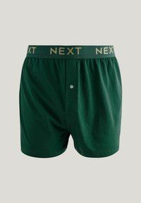 Grüne Baumwoll-Boxershorts mit einem weichen elastischen Bund, der "NEXT" in Gold zeigt. Mit einer Knopfleiste vorne und einem lässigen Schnitt.