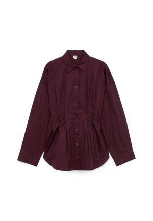 Dark purple long-sleeve button-up shirt with a pointed collar and tailored seams on a white background.