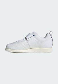 White athletic shoe with a textured upper, lace closure, Velcro strap, and a cream-colored sole. Features a blue accent near the strap.
