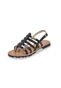 Sandalo in pelle verniciata nera con più cinghie, punta aperta e cinghia posteriore fissata da una fibbia dorata; suola testurizzata per una migliore aderenza.