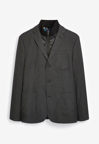 Blazer gris con textura, con cuello de solapa, dos bolsillos frontales y forro interior con cremallera. Cuenta con dos botones y un corte clásico.