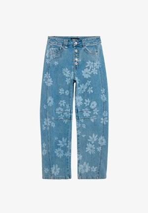 Kék farmernadrág világos virágmintával, díszített színes gombokkal, elülső zsebekkel és egyenes szárú szabással.