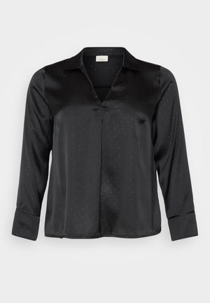 Blusa nera in satin con scollatura a V, maniche lunghe e motivo a pois discreto. Presenta un colletto classico e polsini con bottoni per un look curato.