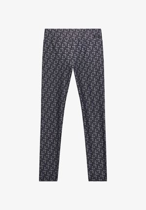 Leggings neri con un motivo geometrico ripetuto in tonalità di grigio, caratterizzati da una texture liscia e un design aderente.