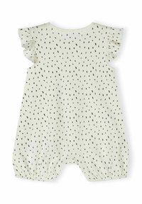 Mameluco de color beige claro con patrón de puntos negros, que presenta mangas amplias y puños elásticos en las piernas. Fabricado con una tela suave y de corte holgado.