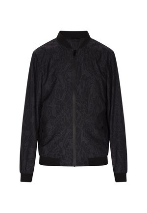 Melna bomber jakne ar smalku abstraktu rakstu, ribainiem piedurknēm un apkakli, ar rāvējslēdzēja aizdari un divām sānu kabatām. Izgatavota no viegla auduma.