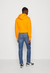 Levi's® 511 SLIM - Jeans straight leg - chanterelle cool