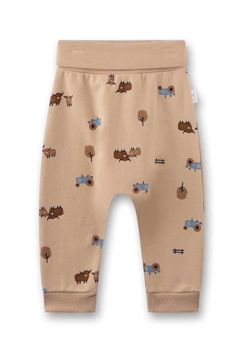 Beige Jersey-Hosen mit einem elastischen Bund, die ein Muster aus braunen Bisons, blauen Traktoren und braunen Bäumen aufweisen, mit umgeschlagenen Knöcheln.