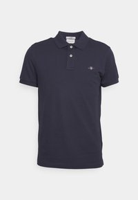 Marineblaues kurzärmeliges Poloshirt mit zwei Knöpfen und kleinem gesticktem GANT-Logo auf der linken Brust.