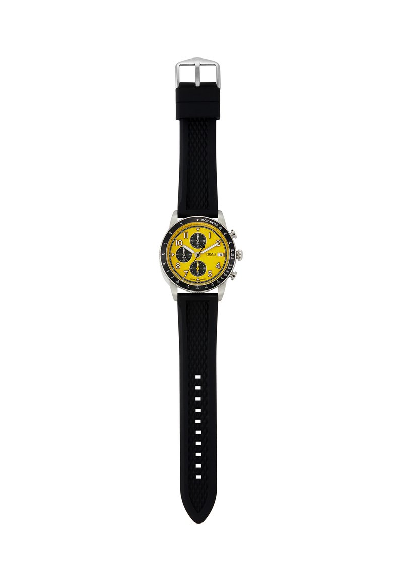 Reloj de pulsera analógico con esfera amarilla, tres subesferas negras, correa de silicona negra, bisel plateado y marcas de taquímetro en el borde exterior.