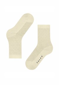 Cremefarbene Baumwollsocken mit einem strukturierten, sechseckigen Muster, einem gerippten Bündchen und dem Markennamen "FALKE" auf der Seite aufgedruckt.