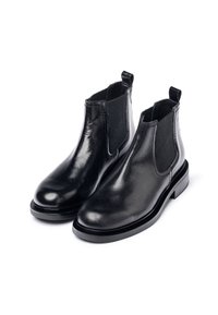 Stivali Chelsea in pelle nera con pannelli elasticizzati laterali, punta tonda e tacco basso a blocco. Presentano una superficie liscia e una linguetta sul retro.