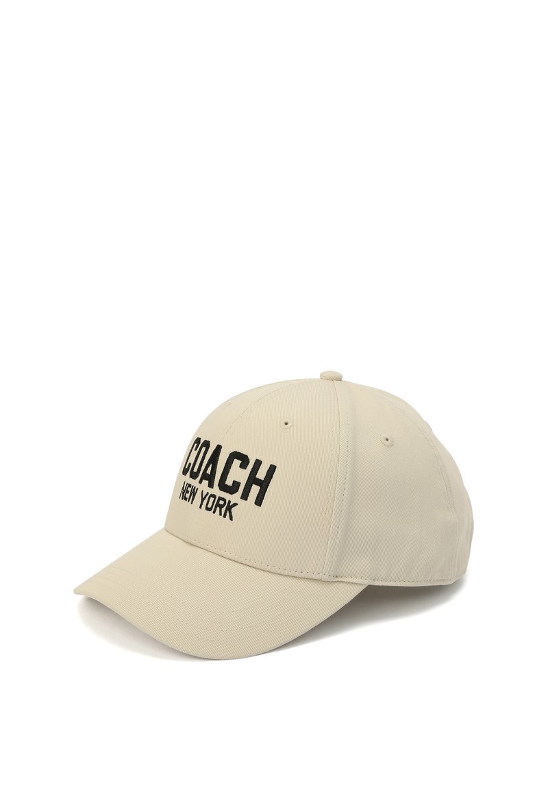 Beige baseballkeps i bomullsblandning, med svart broderad text "COACH NEW YORK", med en böjd skärm och justerbart nackband.