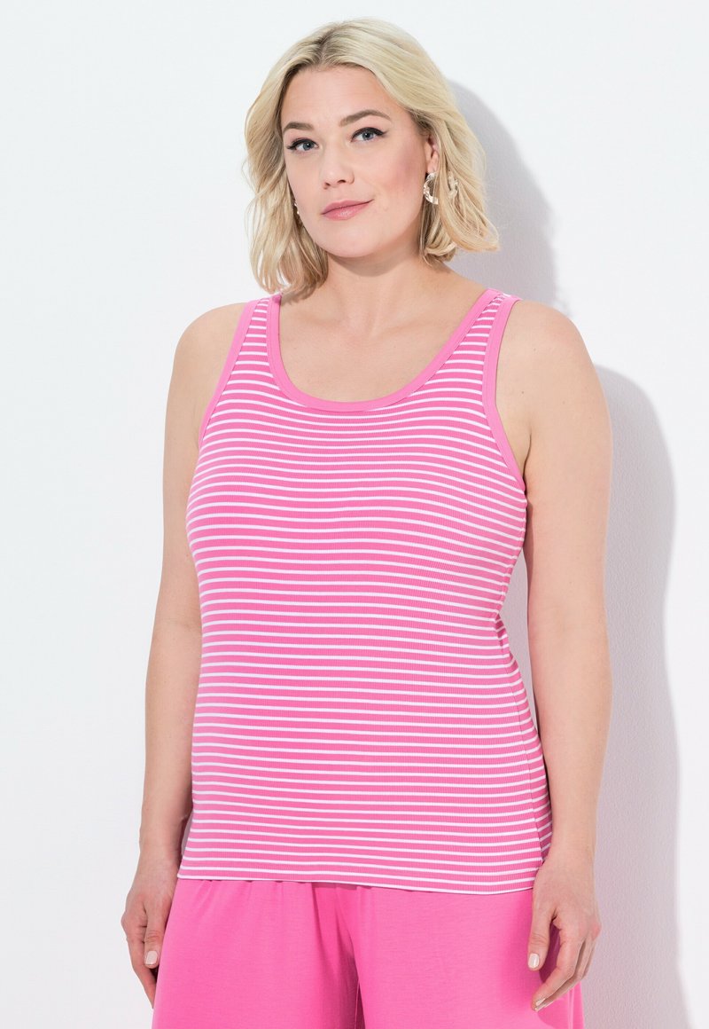 Canotta a righe rosa e bianche con scollatura a barchetta. Realizzata in tessuto morbido ed elasticizzato, presenta spalline larghe e un design aderente.