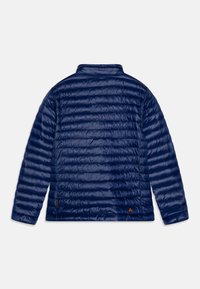 Navy blue insulated jacket with quilted pattern, high collar, and smooth texture. Features a small logo on the lower side.