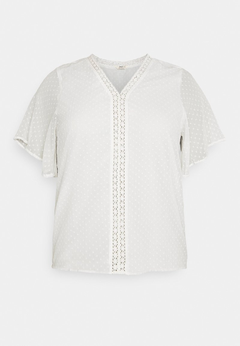 Hvid bluse med korte ærmer og V-hals, med et prikmønster og blonder trim langs forsiden. Let og glat tekstur.