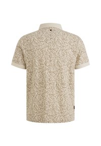 Polo a maniche corte in beige con un motivo astratto marrone, dotato di colletto classico e un piccolo dettaglio con bottone sul retro.