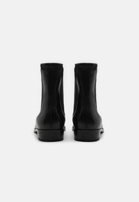 AllSaints STEAM BOOT - Botas clássicas de cano curto - black