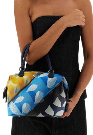 Borsa colorata con finitura testurizzata, caratterizzata da una sfumatura di giallo e blu con motivi di foglie bianche e manici blu.