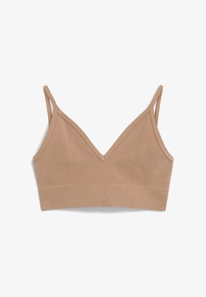 Beige bh met een v-hals, geribbelde textuur en twee verstelbare bandjes. Heeft een brede onderband en subtiele reliëfdetails.