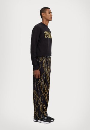 CHAIN LOGO - Pantalon de survêtement - black/gold