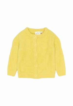 Gul strikket cardigan med rund halsudskæring, lange ærmer og fem-knap lukning. Blød tekstur med ribbet søm og manchetter.