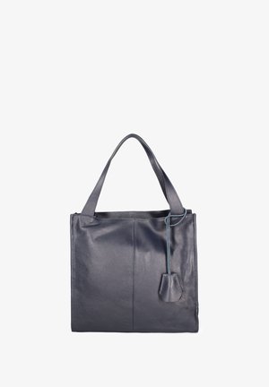 Sac tote en cuir bleu foncé avec finition texturée, deux poignées robustes et une petite étiquette amovible. Les dimensions offrent amplement d'espace pour les essentiels.