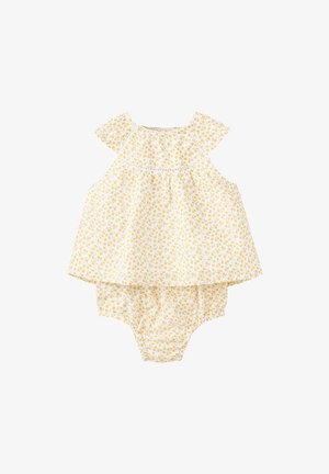 Gul blomstermønstret baby romper uden ærmer med løs top og samlet bund på hvid baggrund.